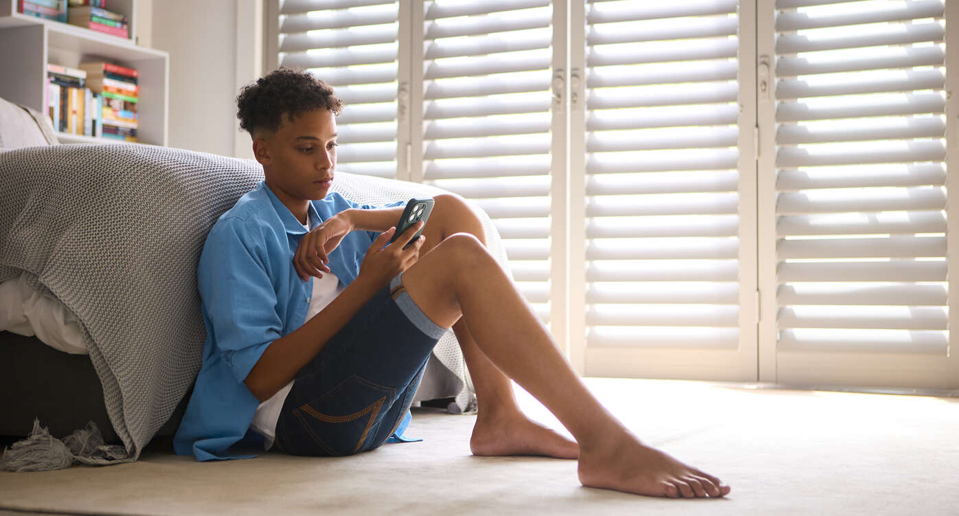 Anxious teen looking at screen